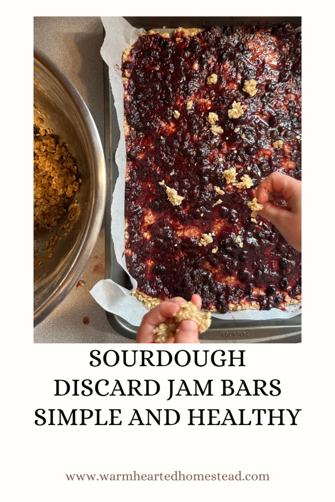 child putting the topping on the healthy and simple. sourdough discard jam bars.